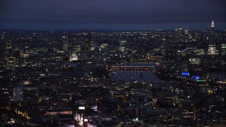 AX116_190 - 5.5K aerial stock footage of flying by Central London cityscape around River Thames, London, England, night