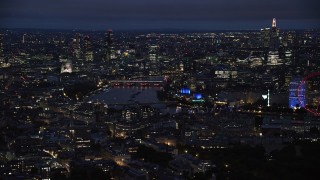 AX116_191 - 5.5K aerial stock footage of cityscape and The Shard around River Thames, London, England, night
