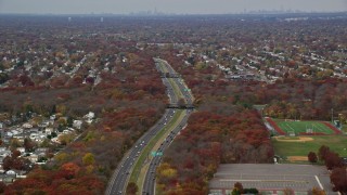 AX117_004E - 5.5K aerial stock footage of Southern State Parkway in Autumn, Farmingdale, New York
