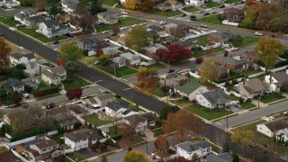 AX117_006 - 5.5K aerial stock footage of suburban homes in Autumn, Massapequa, New York