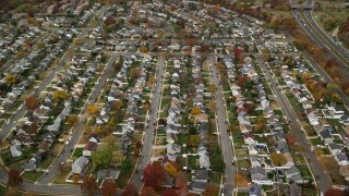AX117_015E - 5.5K aerial stock footage approach and fly over a suburban neighborhood in Autumn, Wantagh, New York