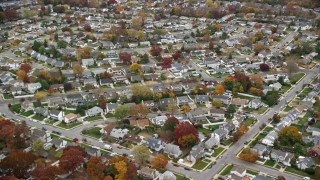 AX117_048E - 5.5K aerial stock footage of flying over suburban neighborhoods in Autumn, Wantagh, New York