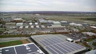 AX117_061E - 5.5K aerial stock footage of Republic Airport in Autumn, Farmingdale, New York