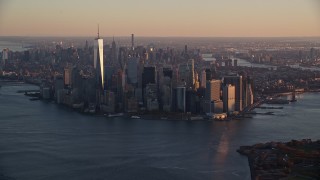 AX118_083 - 5.5K stock footage aerial video of a slow approach to Lower Manhattan at sunrise, New York City