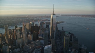 AX118_096E - 5.5K aerial stock footage of a wide orbit of Freedom Tower at sunrise in Lower Manhattan, New York City