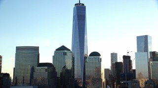 AX118_155E - 5.5K aerial stock footage of the One World Trade Center skyscraper at sunrise in New York City