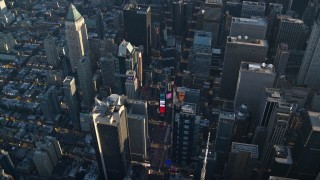 AX118_184E - 5.5K aerial stock footage of Times Square at sunrise in New York City