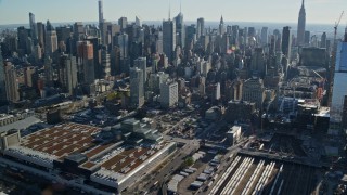 AX119_026E - 5.5K aerial stock footage of convention center and West Side Yard in Hell's Kitchen in Midtown, New York City