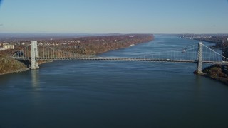 AX119_043 - 5.5K aerial stock footage of approaching George Washington Bridge in Autumn, New York City
