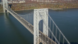 AX119_044E - 5.5K aerial stock footage of an approach to the George Washington Bridge in Autumn, New York City