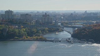 AX119_054E - 5.5K aerial stock footage of the Henry Hudson Bridge in Autumn, The Bronx, New York City