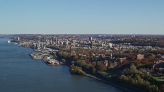 AX119_060 - 5.5K aerial stock footage approach Yonkers by the Hudson River in New York in Autumn