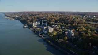 AX119_071E - 5.5K aerial stock footage of riverfront apartment buildings in Autumn, Yonkers, New York