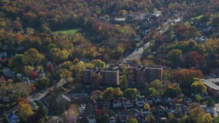 AX119_077 - 5.5K aerial stock footage orbiting small town of Hastings on Hudson, New York, in Autumn