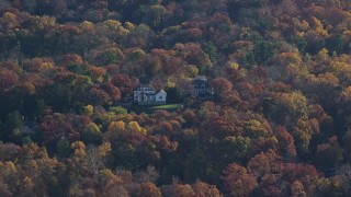 AX119_083E - 5.5K aerial stock footage of a pair of mansions in Autumn, Irvington, New York
