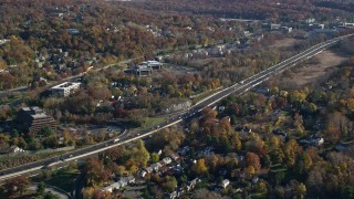 AX119_086 - 5.5K aerial stock footage of light highway traffic in Autumn, Tarrytown, New York