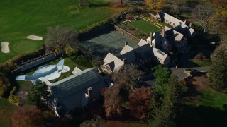 AX119_098 - 5.5K aerial stock footage orbit guest house at Kykuit Estate in Autumn, Westchester County, New York