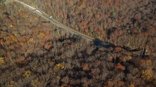 AX119_099 - 5.5K aerial stock footage fly over forest in Autumn, Sleepy Hollow, New York
