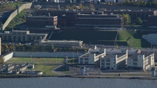 AX119_123E - 5.5K aerial stock footage of Sing Sing Prison in Autumn, Ossining, New York