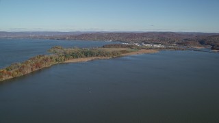 AX119_125E - 5.5K aerial stock footage of approaching Croton Point Park in Autumn, Croton on Hudson, New York