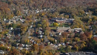 AX119_131E - 5.5K aerial stock footage of homes near near high and middle schools in Autumn, Croton on Hudson, New York