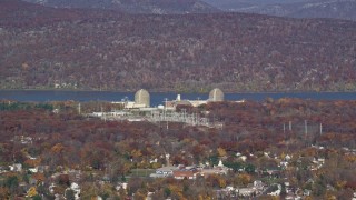 AX119_137 - 5.5K aerial stock footage of Indian Point Nuclear Power Plant in Autumn, Buchanan, New York