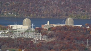 AX119_138E - 5.5K aerial stock footage of the Indian Point Nuclear Power Plant in Autumn, Buchanan, New York