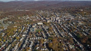 AX119_145E - 5.5K aerial stock footage of small town residential neighborhoods in Autumn, Peekskill, New York