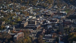 AX119_147 - 5.5K aerial stock footage orbiting small town apartment buildings in Autumn, Peekskill, New York