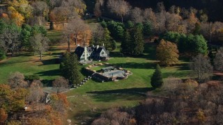 AX119_161 - 5.5K aerial stock footage orbit isolated mansion in Autumn, Garrison, New York
