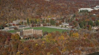 AX119_163 - 5.5K aerial stock footage of Thayer Hotel in Autumn, West Point, New York