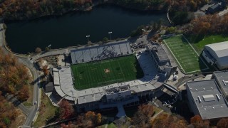 AX119_176E - 5.5K aerial stock footage of Michie Stadium at West Point Military Academy in Autumn, West Point, New York