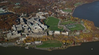 AX119_182E - 5.5K aerial stock footage of a wide orbit by the campus of West Point Military Academy in Autumn, West Point, New York