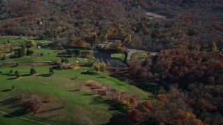 AX119_187 - 5.5K aerial stock footage of a golf course in Autumn, Garrison, New York