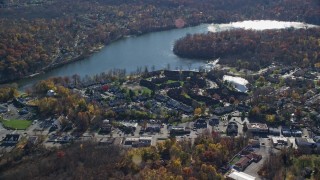 AX119_196 - 5.5K aerial stock footage of lakeside row houses in Autumn, Mohegan Lake, New York