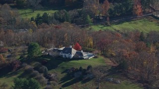 AX119_208E - 5.5K aerial stock footage of a country mansion in Autumn, Mt Kisco, New York