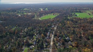AX119_221 - 5.5K aerial stock footage of small town homes in Autumn, Greenwich, Connecticut