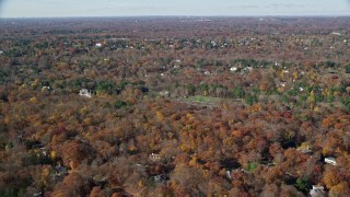 AX119_228 - 5.5K aerial stock footage orbiting upscale homes and trees in Autumn, Greenwich, Connecticut