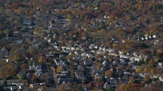 AX119_231 - 5.5K aerial stock footage orbit a small town neighborhood in Autumn, Greenwich, Connecticut