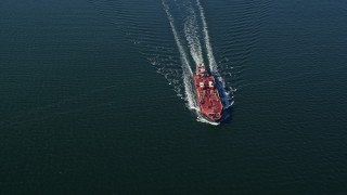 AX119_236 - 5.5K aerial stock footage of an orbit of an oil tanker sailing Long Island Sound