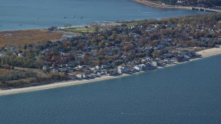 AX119_237 - 5.5K aerial stock footage of small town beachfront homes in Autumn, Bayville, New York