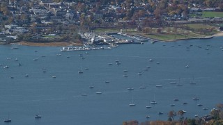AX119_241 - 5.5K aerial stock footage of sailboats near a marina in Autumn, Oyster Bay, New York