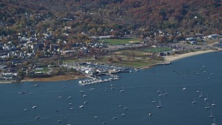 AX119_242 - 5.5K aerial stock footage of an orbit of sailboats near a marina in Autumn, Oyster Bay, New York