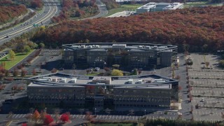 AX119_251 - 5.5K aerial stock footage of orbiting two office buildings in Autumn, Melville, New York