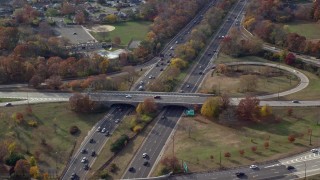 AX120_013E - 5.5K aerial stock footage follow freeway with light traffic in Autumn, Wantagh, New York
