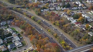 AX120_016E - 5.5K aerial stock footage of light traffic on a freeway in Autumn, Wantagh, New York