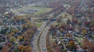 AX120_018 - 5.5K aerial stock footage of a view of light traffic on a freeway in Autumn, North Bellmore, New York