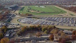 AX120_038 - 5.5K aerial stock footage of a horse-racing track in Autumn, Elmont, New York