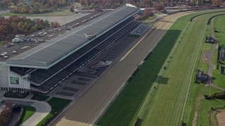 AX120_039 - 5.5K aerial stock footage of stands at a horse-racing track in Autumn, Elmont, New York