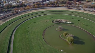 AX120_040 - 5.5K aerial stock footage of flying over a horse-racing track in Autumn, Elmont, New York